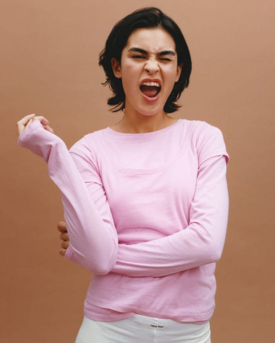 Woman wearing a pink long-sleeve top, Organic Basics Women's Categories